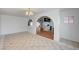 Bright living room featuring tile flooring and an archway leading to the kitchen at 1113 Date St, Las Vegas, NV 89108