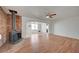 Open living room with wood flooring, arched doorways and a red brick fireplace at 1113 Date St, Las Vegas, NV 89108