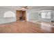Open concept living room with wood flooring, fireplace, and plenty of natural light at 1113 Date St, Las Vegas, NV 89108