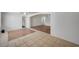 Living room with tile and wood flooring with arched doorways and white walls at 1113 Date St, Las Vegas, NV 89108