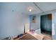 A small storage room painted blue with minimal storage items and a concrete floor at 1113 Date St, Las Vegas, NV 89108