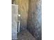 Walk in shower with grey stone detail and modern showerhead at 1297 Peppercorn Ave, Henderson, NV 89012