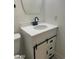 Bathroom vanity with white countertop, black faucet, and sliding barn door detail at 1297 Peppercorn Ave, Henderson, NV 89012