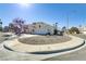 Charming single-story home featuring a well-maintained yard and a two car garage, set against a bright blue sky at 139 Serenade Ct, Henderson, NV 89074
