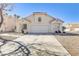 Well-maintained single-story home with a two-car garage, complemented by clean landscaping and a clear blue sky at 139 Serenade Ct, Henderson, NV 89074