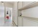 Hallway with built-in cabinets and a glimpse into another room at 139 Serenade Ct, Henderson, NV 89074