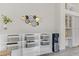 Stylish living room with decorative wall art, shelving, and a modern water cooler at 139 Serenade Ct, Henderson, NV 89074