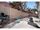 Spacious backyard area with a concrete patio, brick wall and basketball hoop at 1457 Summer Glow Ave, Henderson, NV 89012
