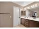 This bathroom features a double sink vanity with white countertop and light fixtures at 1457 Summer Glow Ave, Henderson, NV 89012
