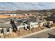 A high angle shot showcases the neighborhood's modern architecture and the lake with mountain backdrop at 148 Tre Pietre St, Henderson, NV 89011