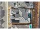 Aerial view of luxury home featuring a gray tile roof, backyard pool, solar panels, and desert landscaping at 148 Tre Pietre St, Henderson, NV 89011
