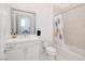 Bathroom features a shower-tub combo and sleek white vanity with a bright, modern aesthetic at 148 Tre Pietre St, Henderson, NV 89011