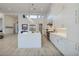 Bright, modern kitchen with white cabinets, a large island, and stainless steel appliances in an open floor plan at 148 Tre Pietre St, Henderson, NV 89011