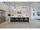 Modern kitchen with sleek countertops, stainless steel appliances, and bar stool seating at 148 Tre Pietre St, Henderson, NV 89011