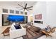 Spacious living room boasts a sleek fireplace, stylish furnishings, and expansive views from sliding doors at 148 Tre Pietre St, Henderson, NV 89011