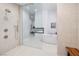 Bright main bathroom with a glass shower, modern tub, and upscale finishes at 148 Tre Pietre St, Henderson, NV 89011