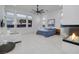 Serene main bedroom boasting large windows, a cozy seating area, and a modern fireplace feature at 148 Tre Pietre St, Henderson, NV 89011