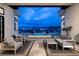 Inviting patio with stylish seating area overlooking a tranquil pool and captivating city views at 148 Tre Pietre St, Henderson, NV 89011