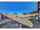 View of backyard with covered patio and block wall for privacy at 1906 Palora Ave, Las Vegas, NV 89169