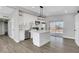 Modern kitchen featuring stainless appliances, an island, sleek countertops, and ample storage space at 1906 Palora Ave, Las Vegas, NV 89169