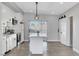 Modern kitchen featuring stainless appliances, an island, sleek countertops, and ample storage space at 1906 Palora Ave, Las Vegas, NV 89169