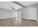 Spacious living room featuring sleek floors, a ceiling fan, natural light, and a modern design at 1906 Palora Ave, Las Vegas, NV 89169