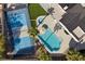 Aerial view featuring a tennis court, a swimming pool, and well-maintained backyard at 1912 Calanda Ct, Las Vegas, NV 89102