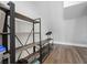 Spacious attic with wood flooring and installed shelving units, offering ample storage at 1912 Calanda Ct, Las Vegas, NV 89102