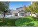 Manicured backyard featuring a putting green, patio area, and outdoor seating perfect for outdoor gatherings at 1912 Calanda Ct, Las Vegas, NV 89102