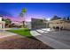 Large backyard with lawn, pool, and separate lighted sports court area at 1912 Calanda Ct, Las Vegas, NV 89102