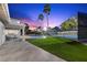 Expansive backyard features a pool, sports court, and ample green space at 1912 Calanda Ct, Las Vegas, NV 89102