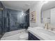 Modern bathroom featuring a sleek vanity, glass enclosed shower, and stylish blue herringbone tile at 1912 Calanda Ct, Las Vegas, NV 89102