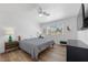 Comfortable bedroom featuring a queen bed, stylish decor, and hardwood floors at 1912 Calanda Ct, Las Vegas, NV 89102