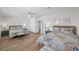 Spacious bedroom with two beds, ceiling fan and neutral decor with wood floors at 1912 Calanda Ct, Las Vegas, NV 89102