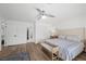 Serene bedroom with a queen size bed, bright white walls, and modern ceiling fan at 1912 Calanda Ct, Las Vegas, NV 89102