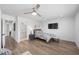Bedroom with wood floors, a ceiling fan and view to the bathroom at 1912 Calanda Ct, Las Vegas, NV 89102
