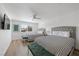 Bright bedroom with two beds, a ceiling fan, and a window providing natural light at 1912 Calanda Ct, Las Vegas, NV 89102