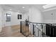 Bright hallway featuring wood floors and contemporary staircase leading to upper level at 1912 Calanda Ct, Las Vegas, NV 89102