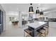 Open concept kitchen with a large island, stainless steel appliances, and seamless flow into the dining area at 1912 Calanda Ct, Las Vegas, NV 89102