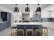 Modern kitchen with a center island, stainless steel appliances, and stylish pendant lighting at 1912 Calanda Ct, Las Vegas, NV 89102