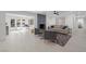 Open concept living space with fireplace, leading to a patio with a pool view at 1912 Calanda Ct, Las Vegas, NV 89102