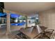 Covered patio area with large table perfect for outdoor dining and entertaining at 1912 Calanda Ct, Las Vegas, NV 89102