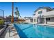 A beautiful pool with a diving board, patio area, and backyard seating perfect for outdoor gatherings at 1912 Calanda Ct, Las Vegas, NV 89102