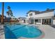 A stunning pool with a diving board, patio area, and backyard seating perfect for outdoor gatherings at 1912 Calanda Ct, Las Vegas, NV 89102