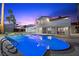 Gorgeous backyard pool with attached spa and patio seating at 1912 Calanda Ct, Las Vegas, NV 89102