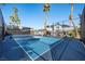 Full-size tennis court with the home visible in the background at 1912 Calanda Ct, Las Vegas, NV 89102