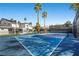 Full-size tennis court with the property visible in the background at 1912 Calanda Ct, Las Vegas, NV 89102