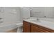 Neat bathroom featuring a white vanity, modern fixtures, a shower, and toilet for comfort and convenience at 2624 Courlan Dr, North Las Vegas, NV 89084