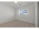 Simple, carpeted bedroom with natural light from a window at 2624 Courlan Dr, North Las Vegas, NV 89084