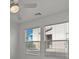 Bright bedroom featuring a ceiling fan and large windows for natural light and comfort at 2624 Courlan Dr, North Las Vegas, NV 89084